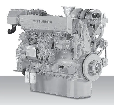 An older S6B3-MPTA marine engine, grey-painted studio shot with the Mitsubishi wordmark cast into the block