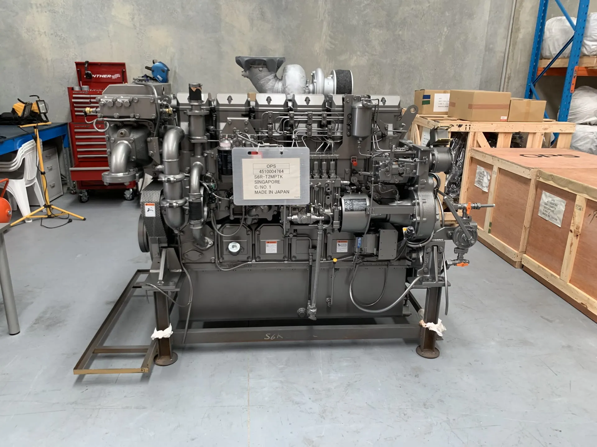 An S6R-T2MPTK marine engine on a fabrication stand in OPS's Wangara warehouse workshop